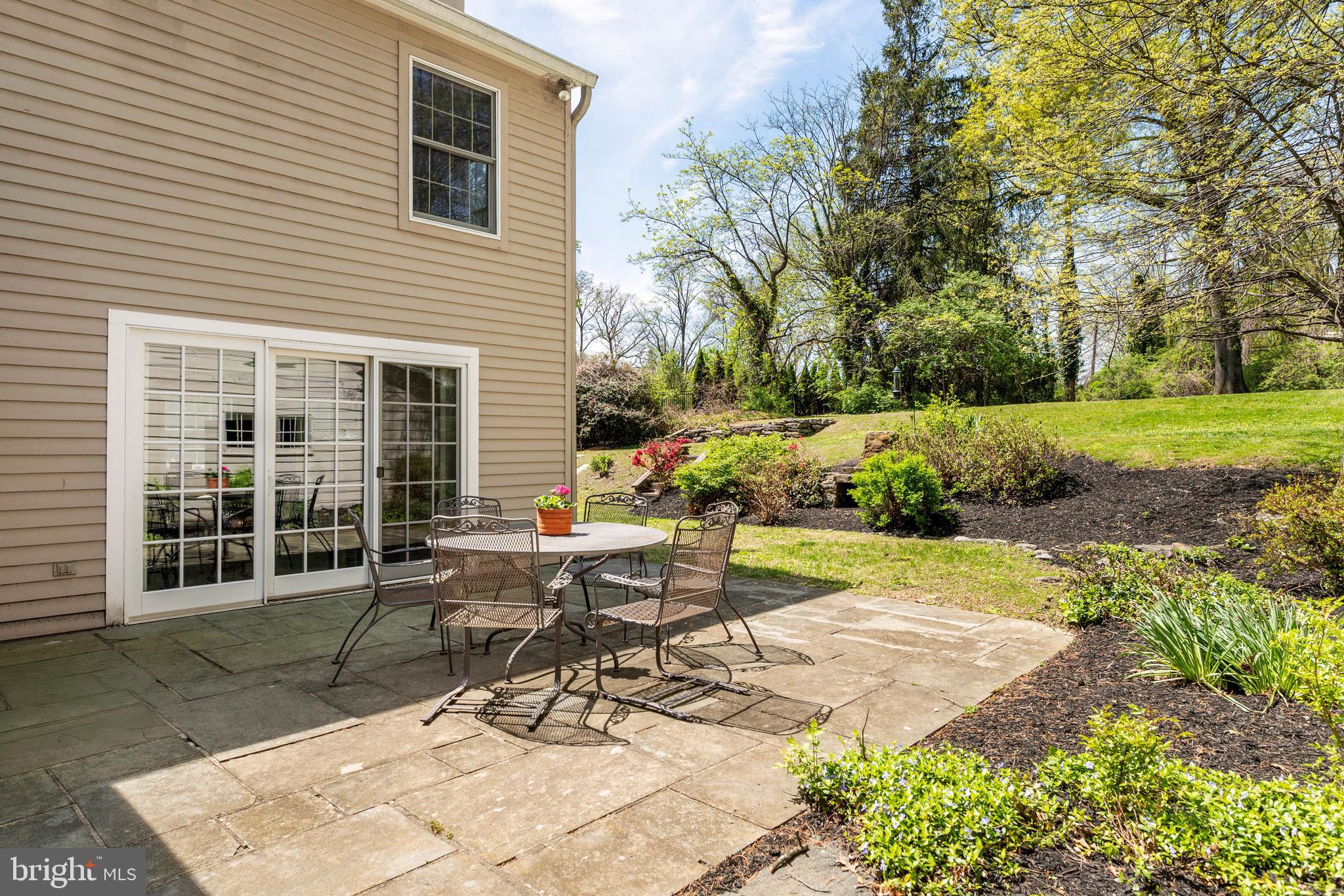 912 Centennial Road Penn Valley, PA 19072 - Photo 47 of 54 a view of a backyard with sitting area and furniture