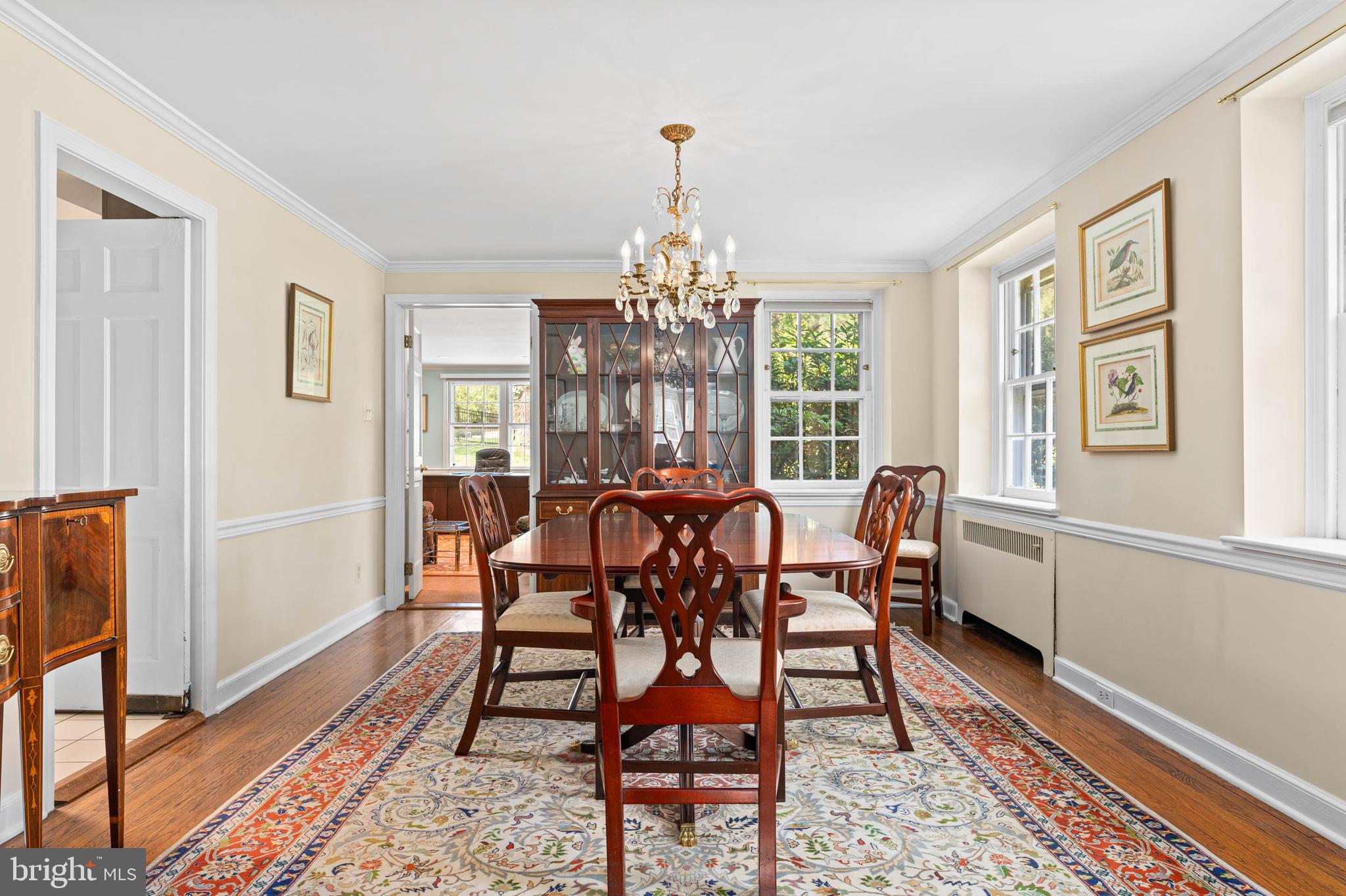 912 Centennial Road Penn Valley, PA 19072 - Photo 5 of 54 a dining room with furniture a chandelier and wooden floor