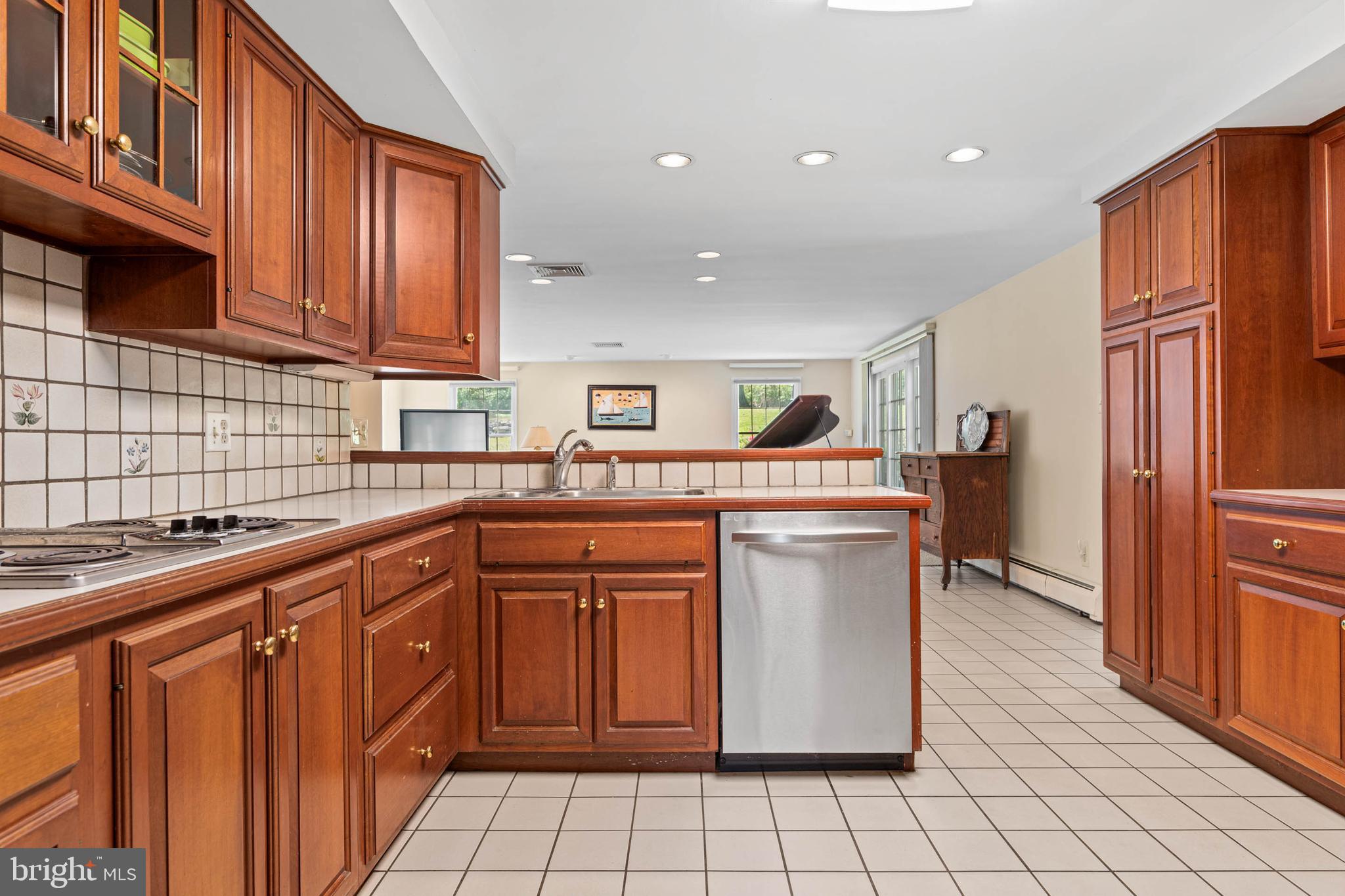 912 Centennial Road Penn Valley, PA 19072 - Photo 10 of 54 a kitchen with stainless steel appliances granite countertop a refrigerator and a sink