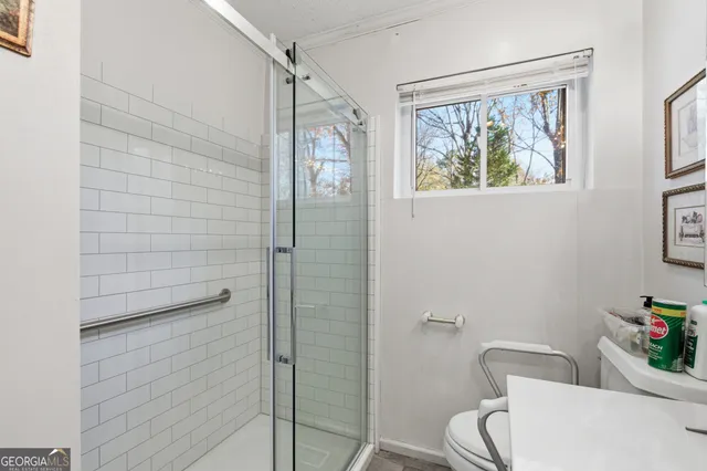 a bedroom with bed and a window