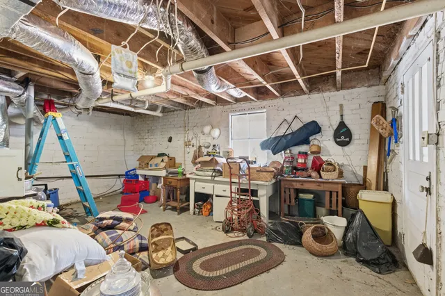 a front view of a house with a yard covered with snow