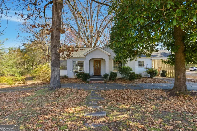 an aerial view of a house with a yard