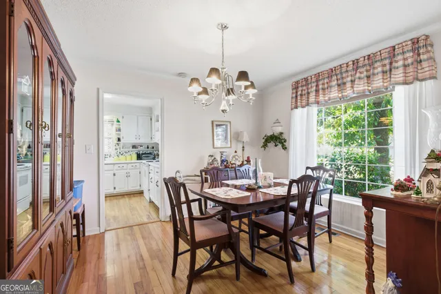 a view of a dining room with furniture window and outside view