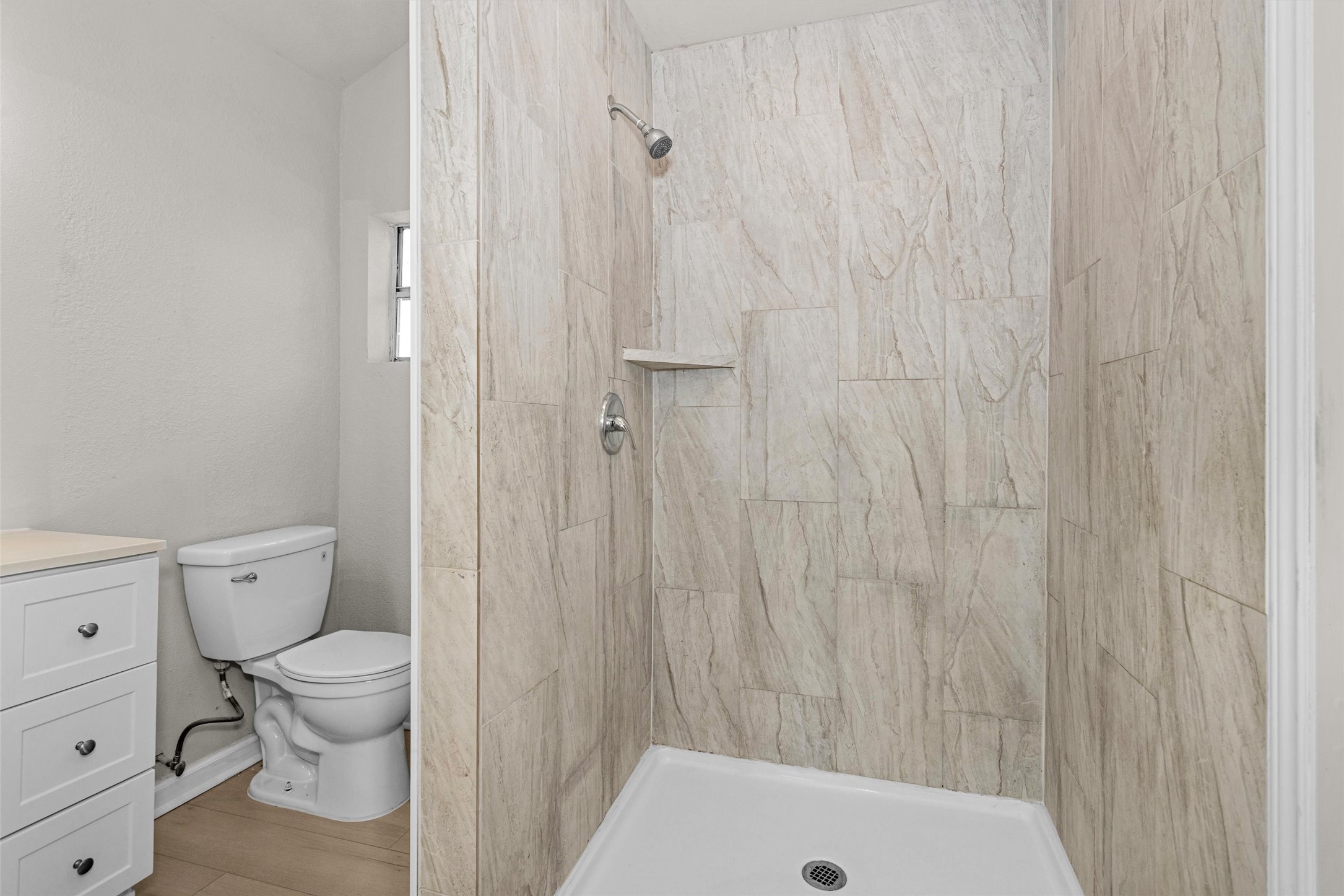 15225 Woodforest Boulevard Channelview, TX 77530 - Photo 25 of 29 a bathroom with a toilet and a shower