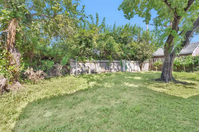 a backyard of a house with lots of green space