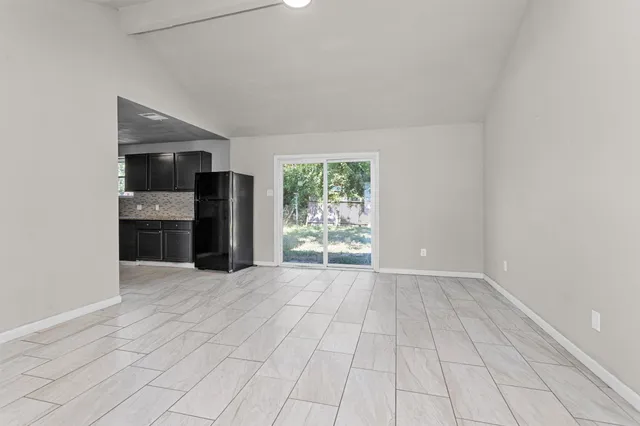 a view of an empty room and window