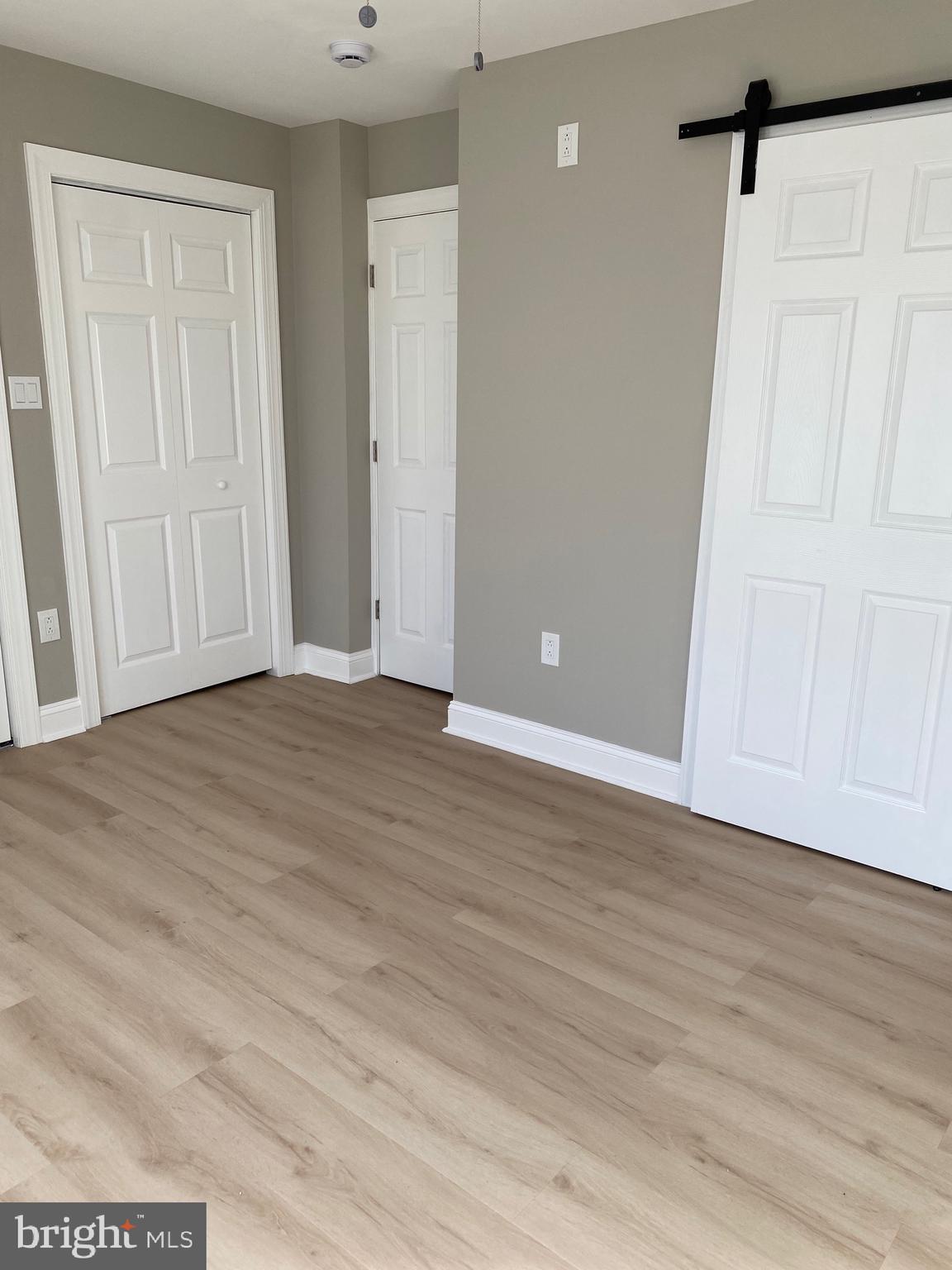 6445 Garman Street Philadelphia, PA 19142 - Photo 16 of 56 a view of an empty room with wooden floor