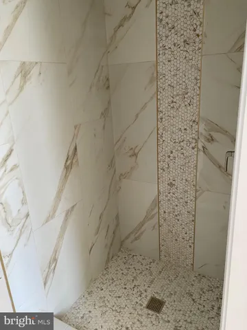 a bathroom with a toilet and a bath tub