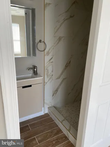 a bathroom with a toilet and a bath tub