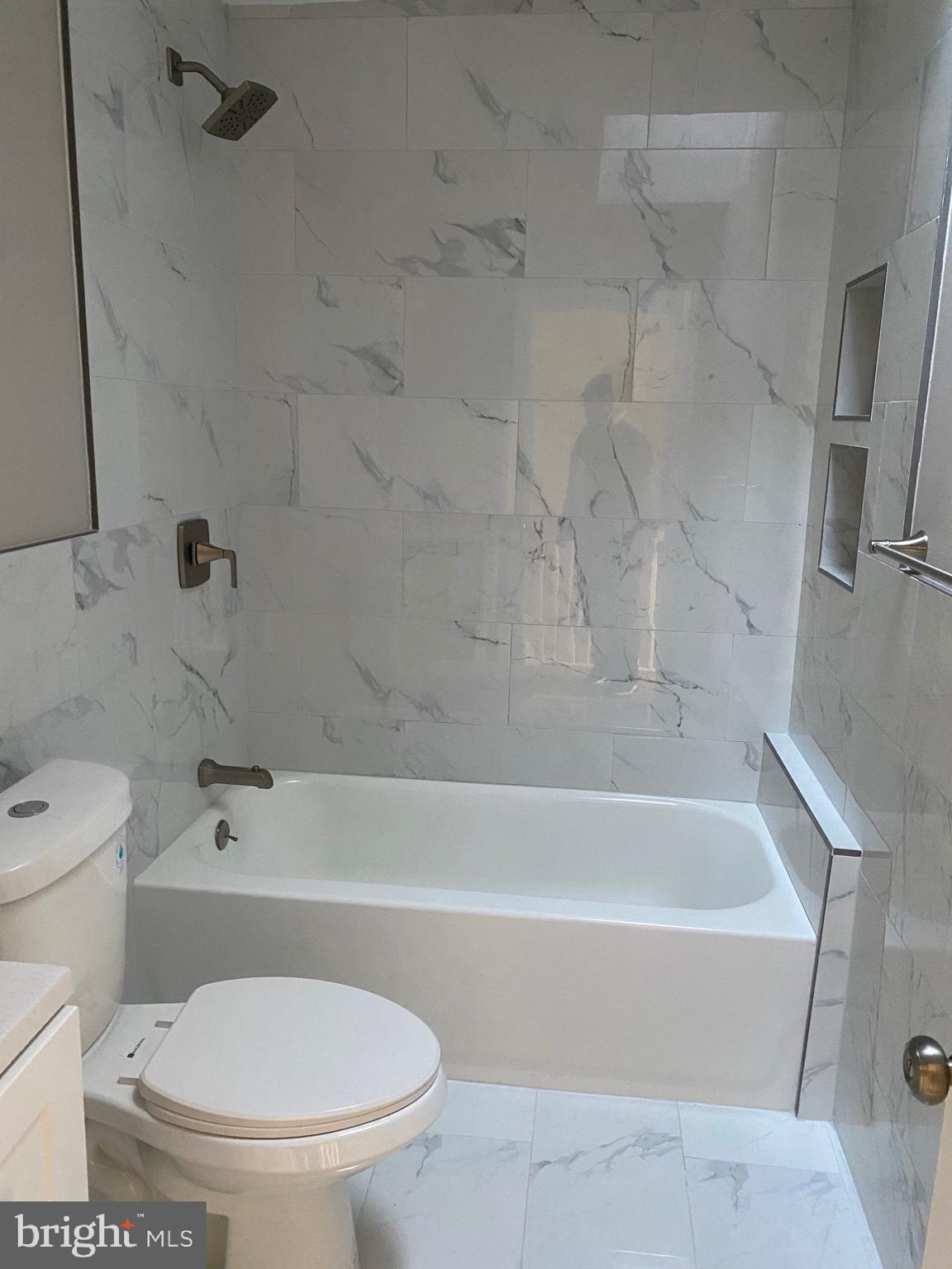 6445 Garman Street Philadelphia, PA 19142 - Photo 30 of 56 a bathroom with a toilet and a bath tub