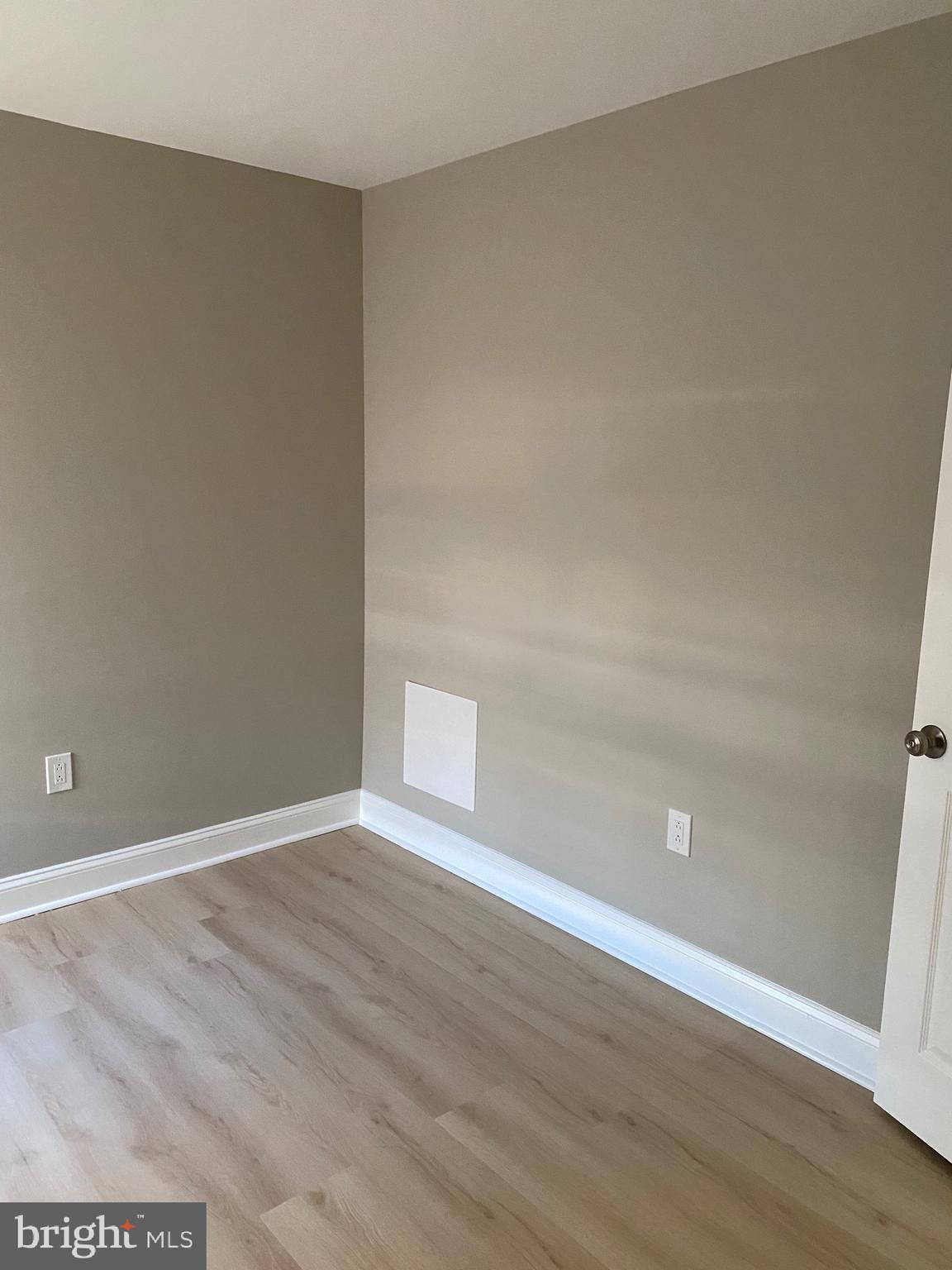 6445 Garman Street Philadelphia, PA 19142 - Photo 32 of 56 a view of an empty room with wooden floor