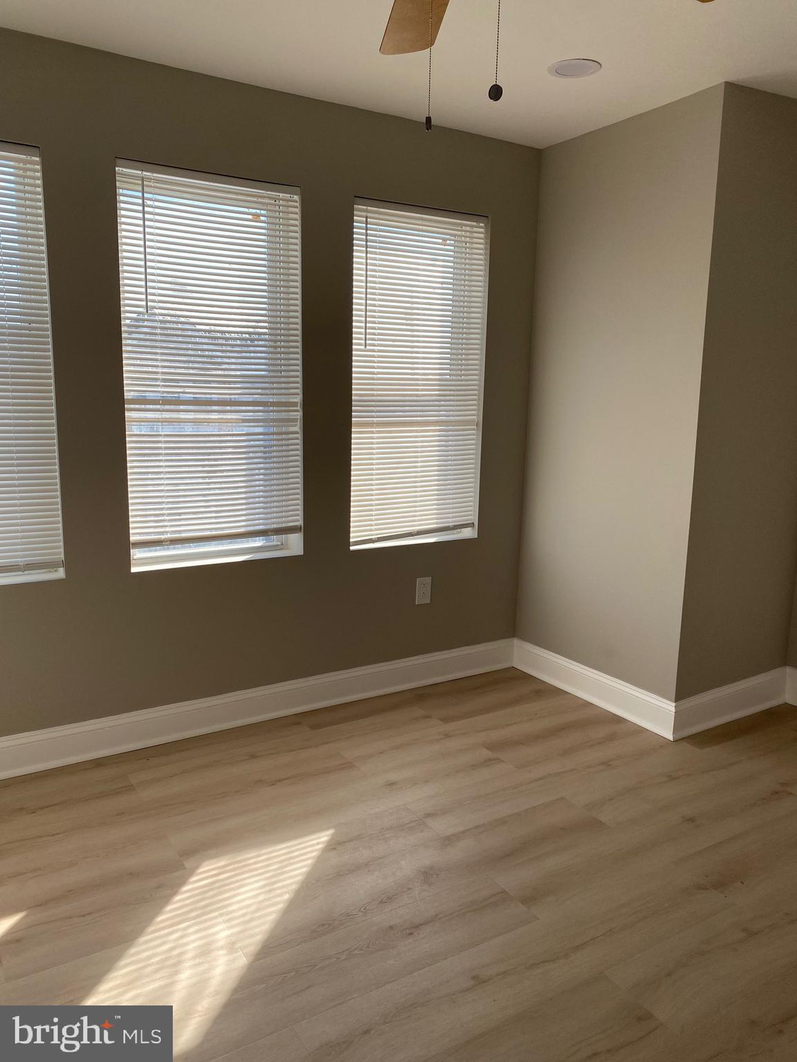 6445 Garman Street Philadelphia, PA 19142 - Photo 4 of 56 a view of an empty room with wooden floor and a window