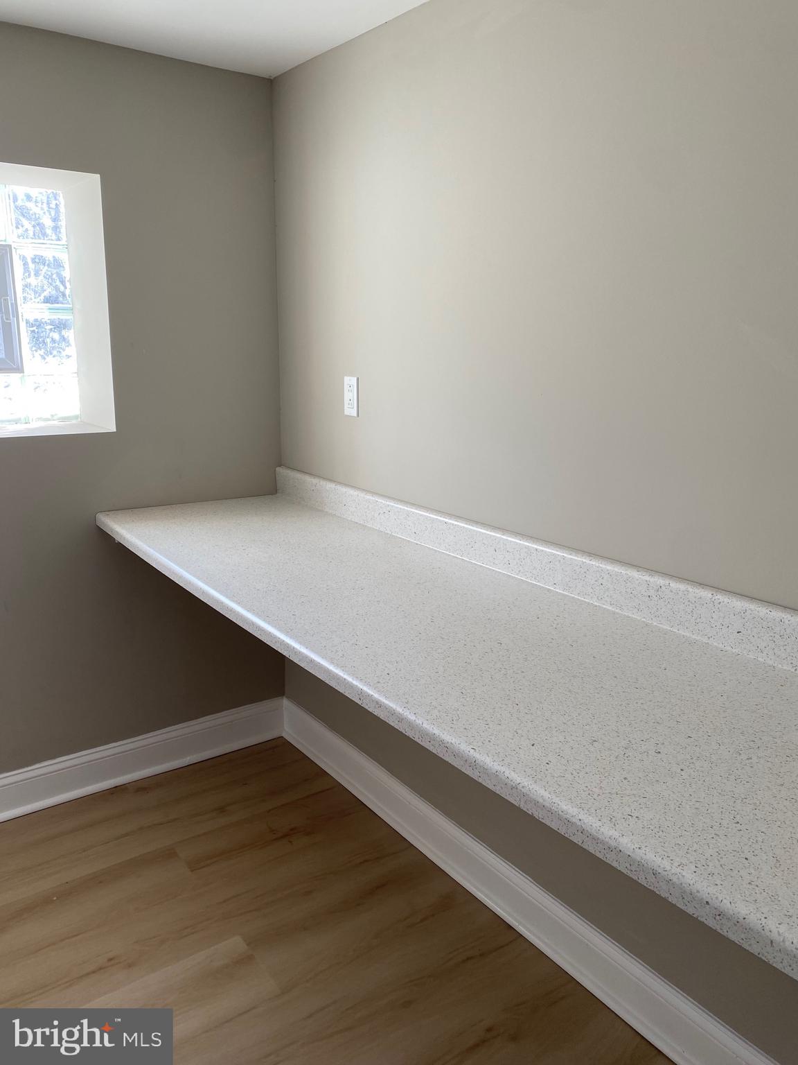 6445 Garman Street Philadelphia, PA 19142 - Photo 45 of 56 a room with a wooden floor and a window