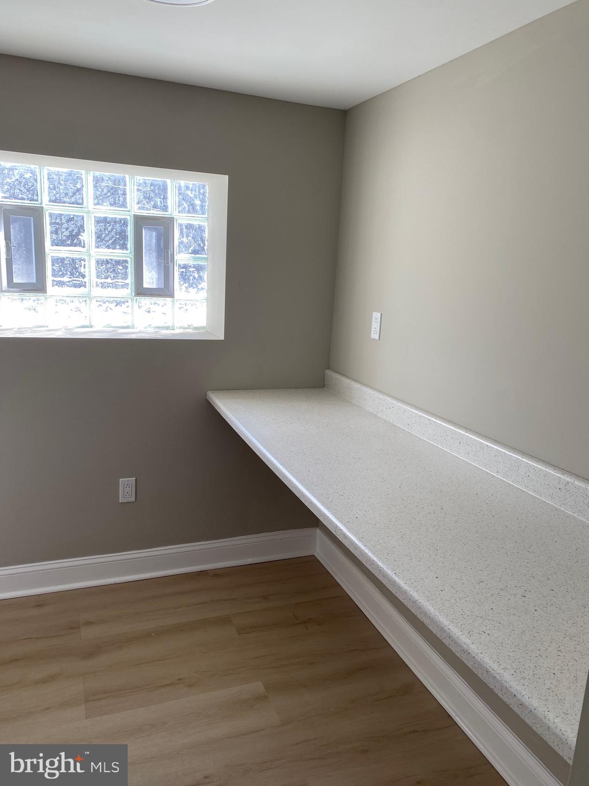 6445 Garman Street Philadelphia, PA 19142 - Photo 46 of 56 a view of an empty room with wooden floor and a window