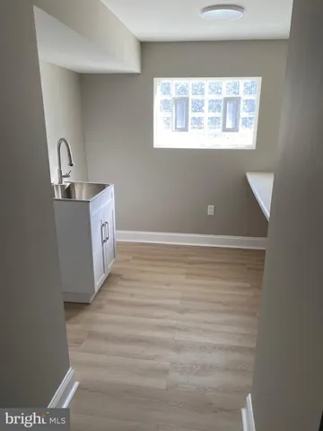 an empty room with wooden floor