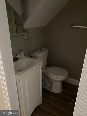 a view of a balcony with wooden floor