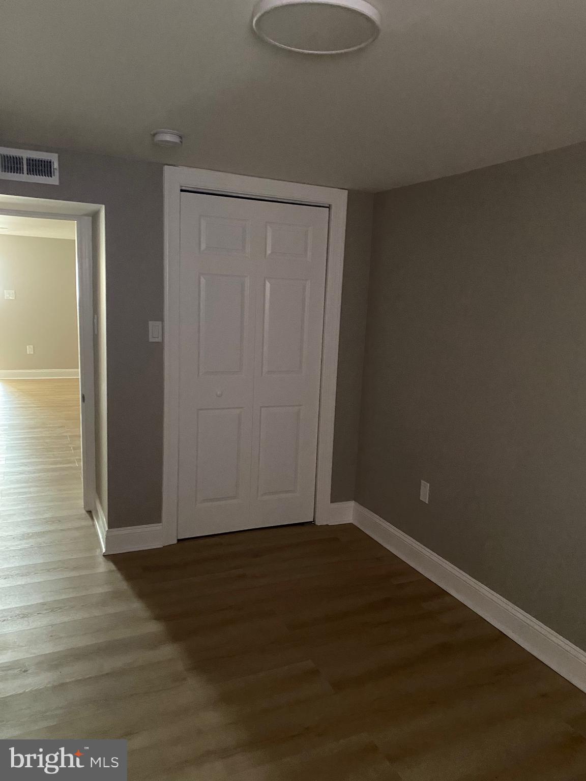 6445 Garman Street Philadelphia, PA 19142 - Photo 50 of 56 a view of an empty room with wooden floor
