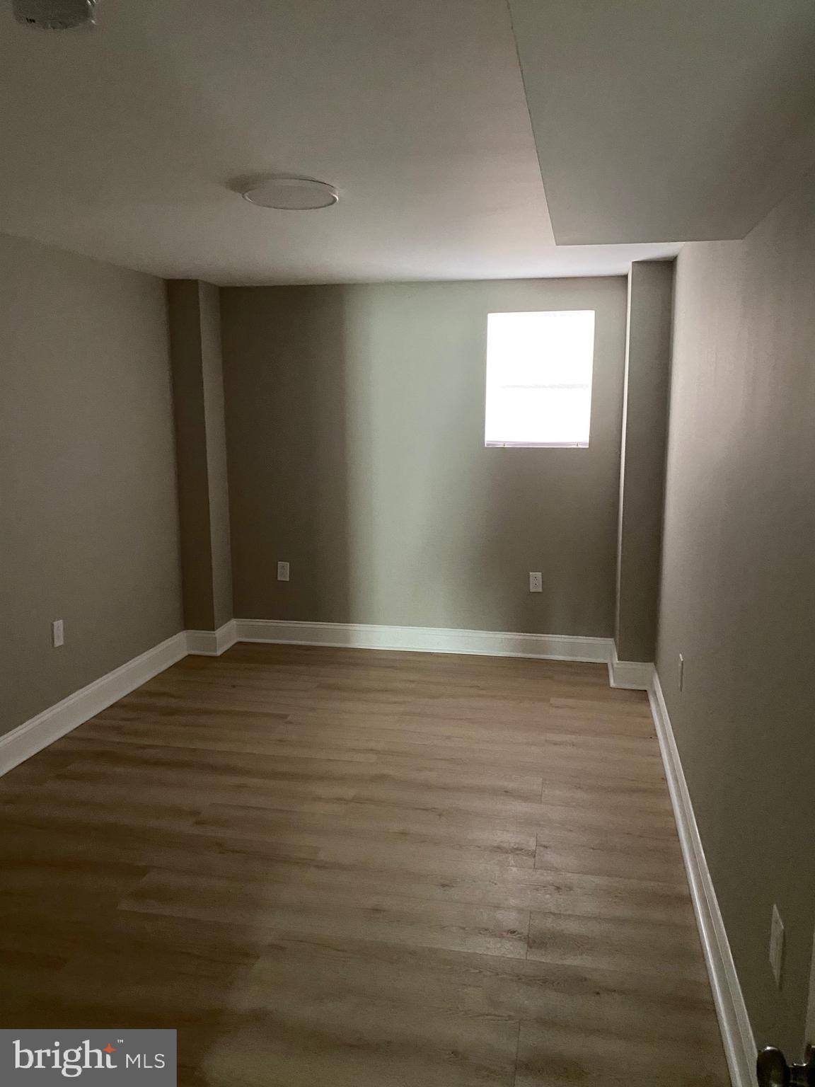6445 Garman Street Philadelphia, PA 19142 - Photo 52 of 56 a view of an empty room with wooden floor