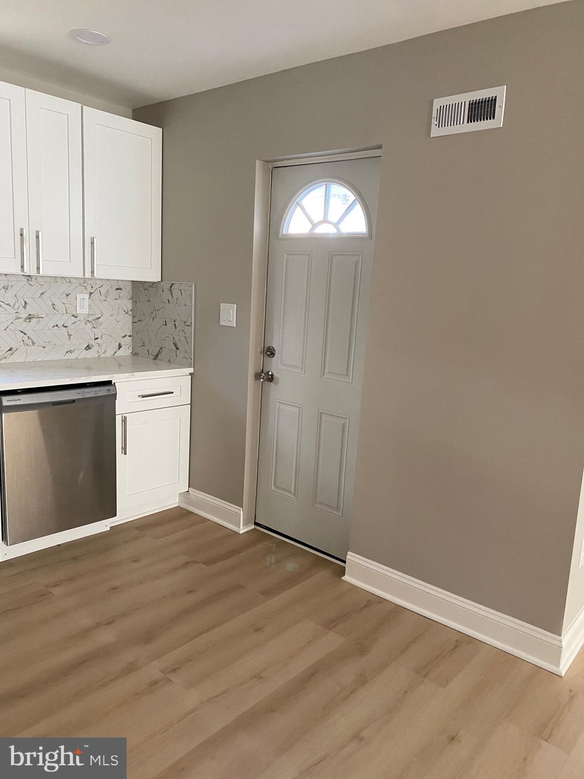 6445 Garman Street Philadelphia, PA 19142 - Photo 7 of 56 a view of a kitchen with granite countertop cabinets and wooden floor