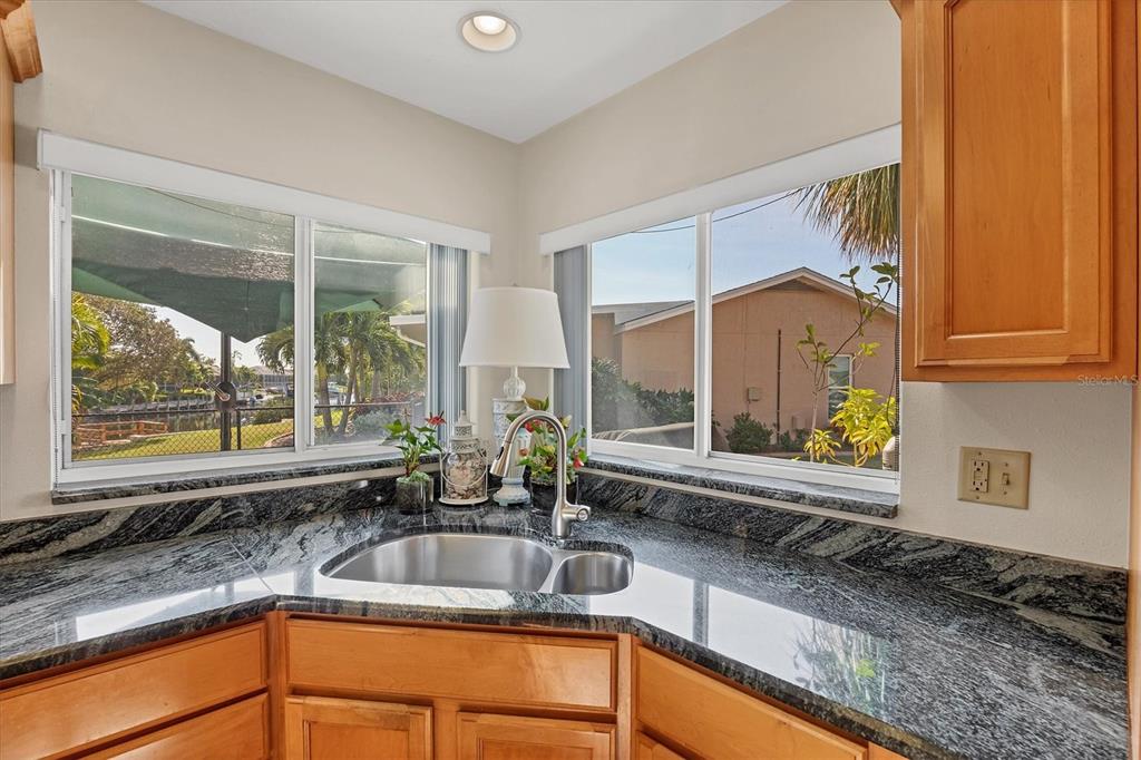 4419 Mangrove Point Road Bradenton, FL 34210 - Photo 11 of 40 a kitchen with a sink and a large window