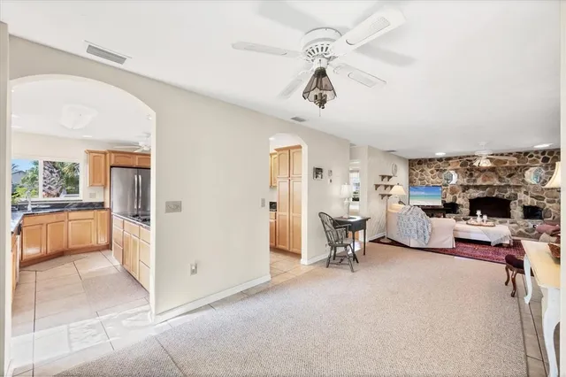a view of a livingroom with furniture and a flat screen tv