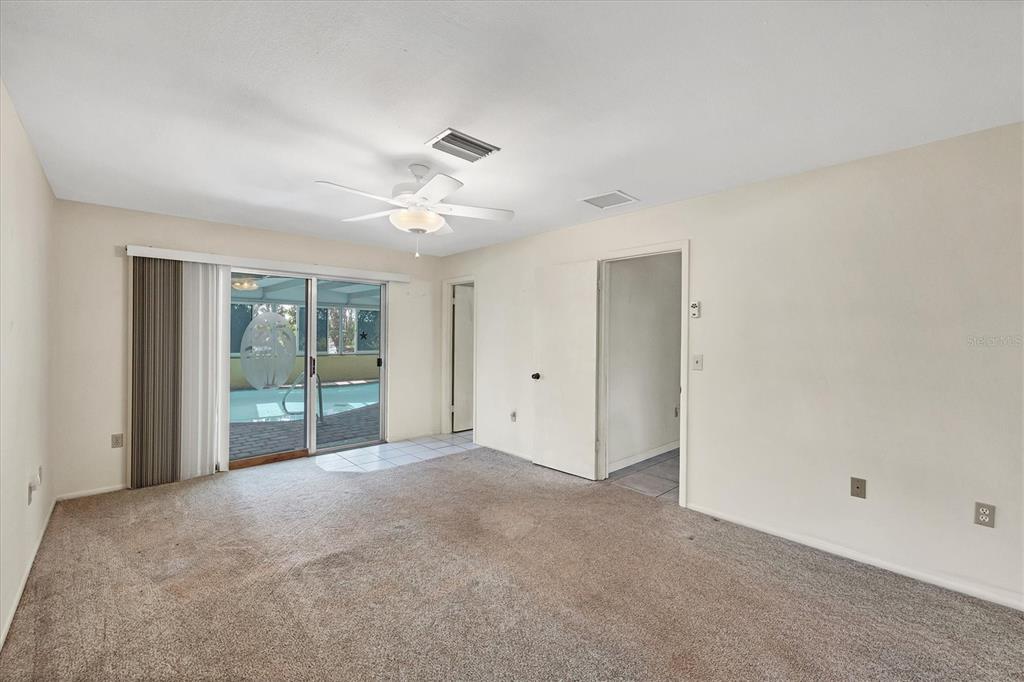 4419 Mangrove Point Road Bradenton, FL 34210 - Photo 16 of 40 a view of an empty room with glass door