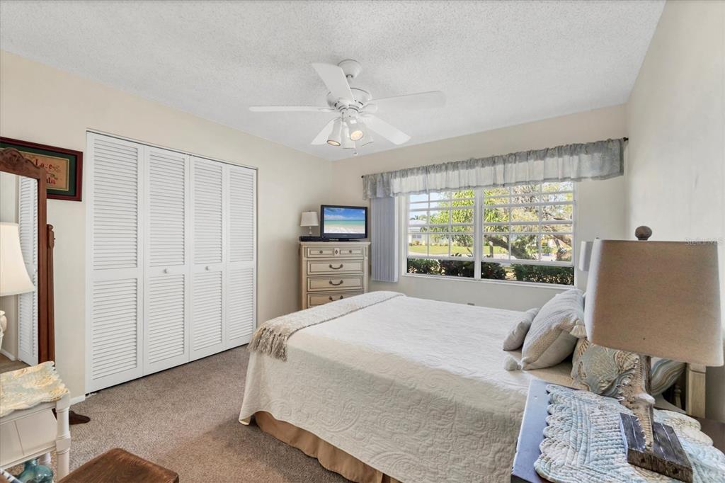 4419 Mangrove Point Road Bradenton, FL 34210 - Photo 20 of 40 a bedroom with a bed and a window