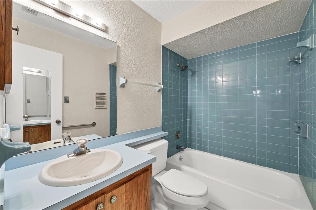 4419 Mangrove Point Road Bradenton, FL 34210 - Photo 22 of 40 a bathroom with a sink toilet tub and shower
