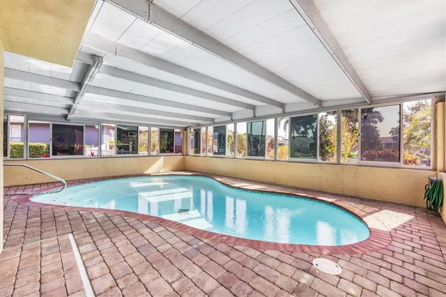 a view of a swimming pool with an outdoor seating