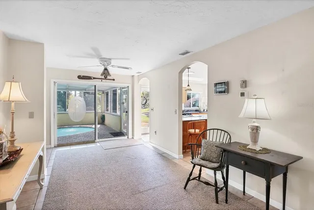 a view of a livingroom with furniture and a window