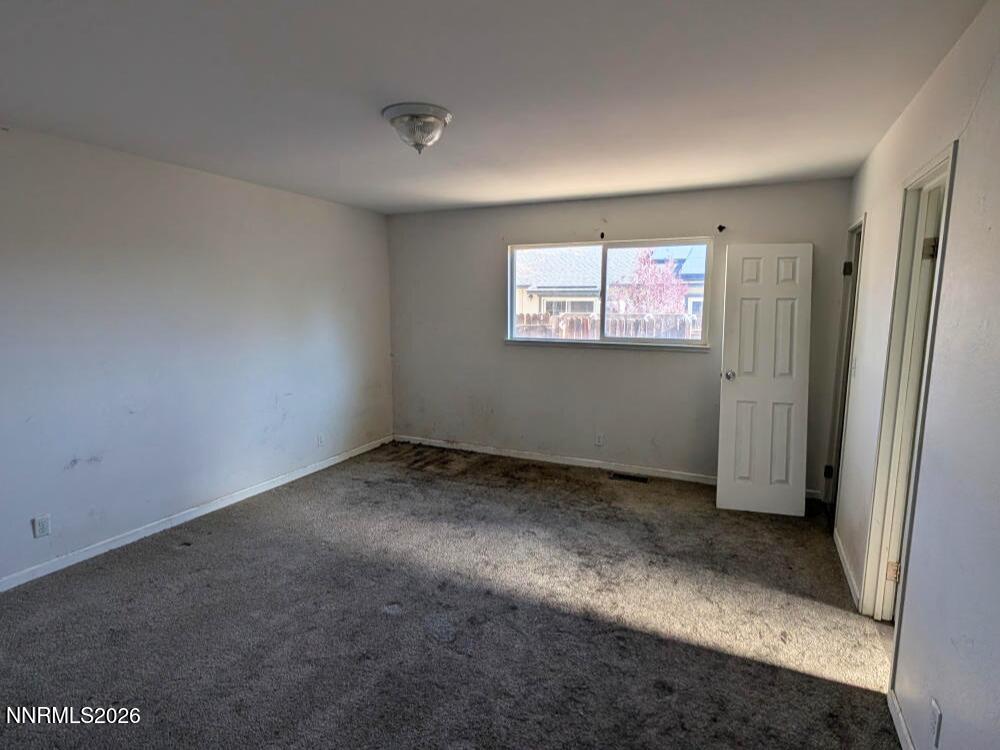 848 C Street Fernley, NV 89408 - Photo 9 of 15 an empty room with windows