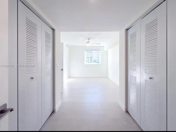 a view of an empty room and window