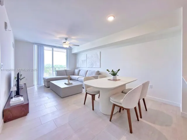 a living room with furniture and a table