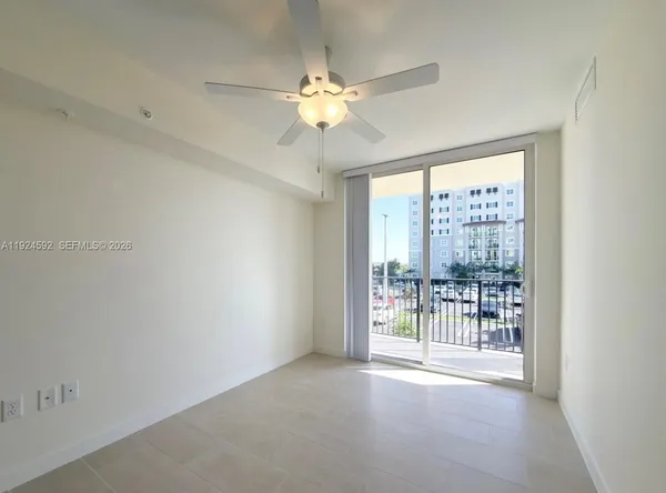 a view of an empty room with a window