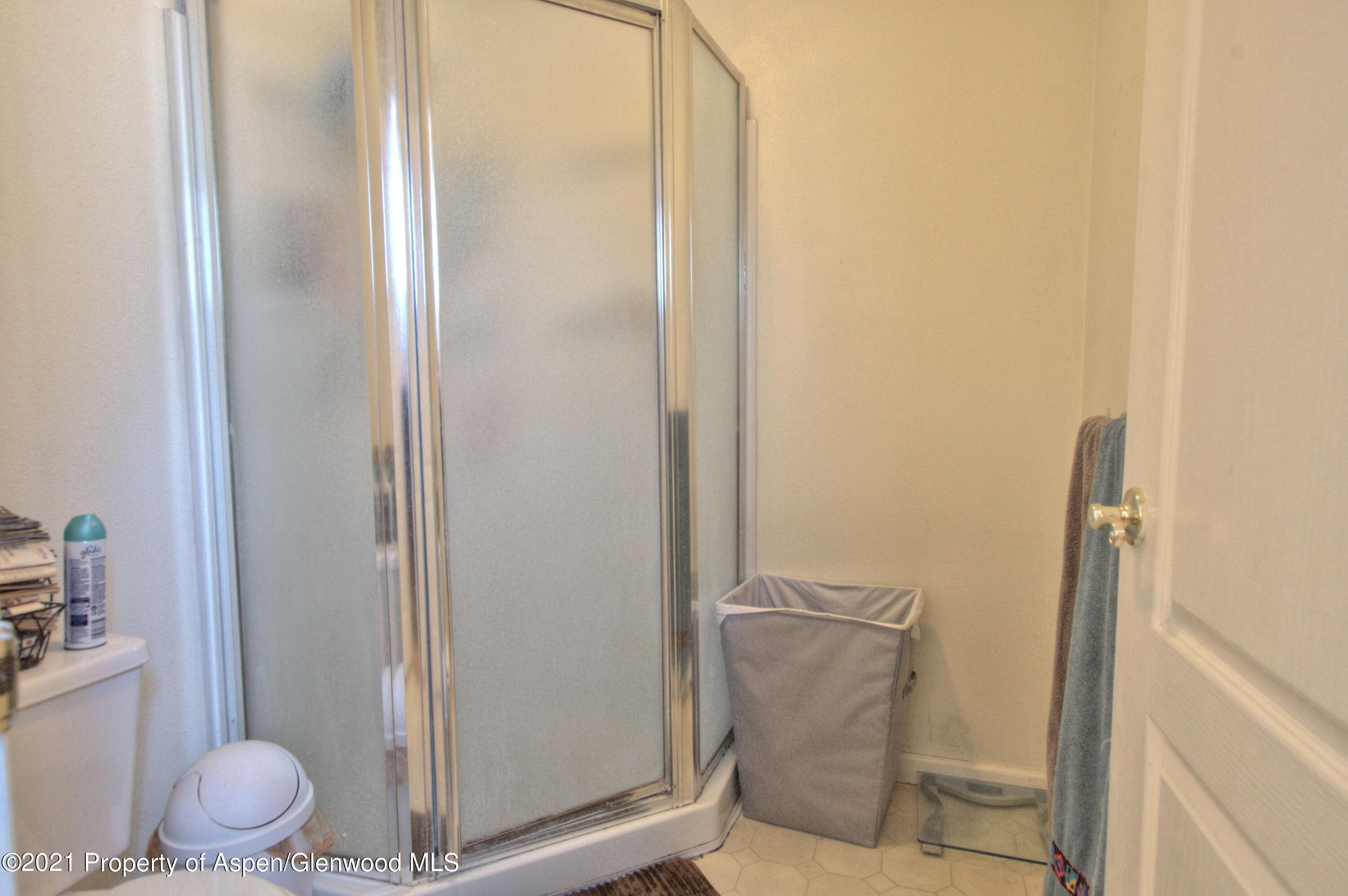 1554 East 12th Street Rifle, CO 81650 - Photo 18 of 31 a bathroom with a shower and toilet
