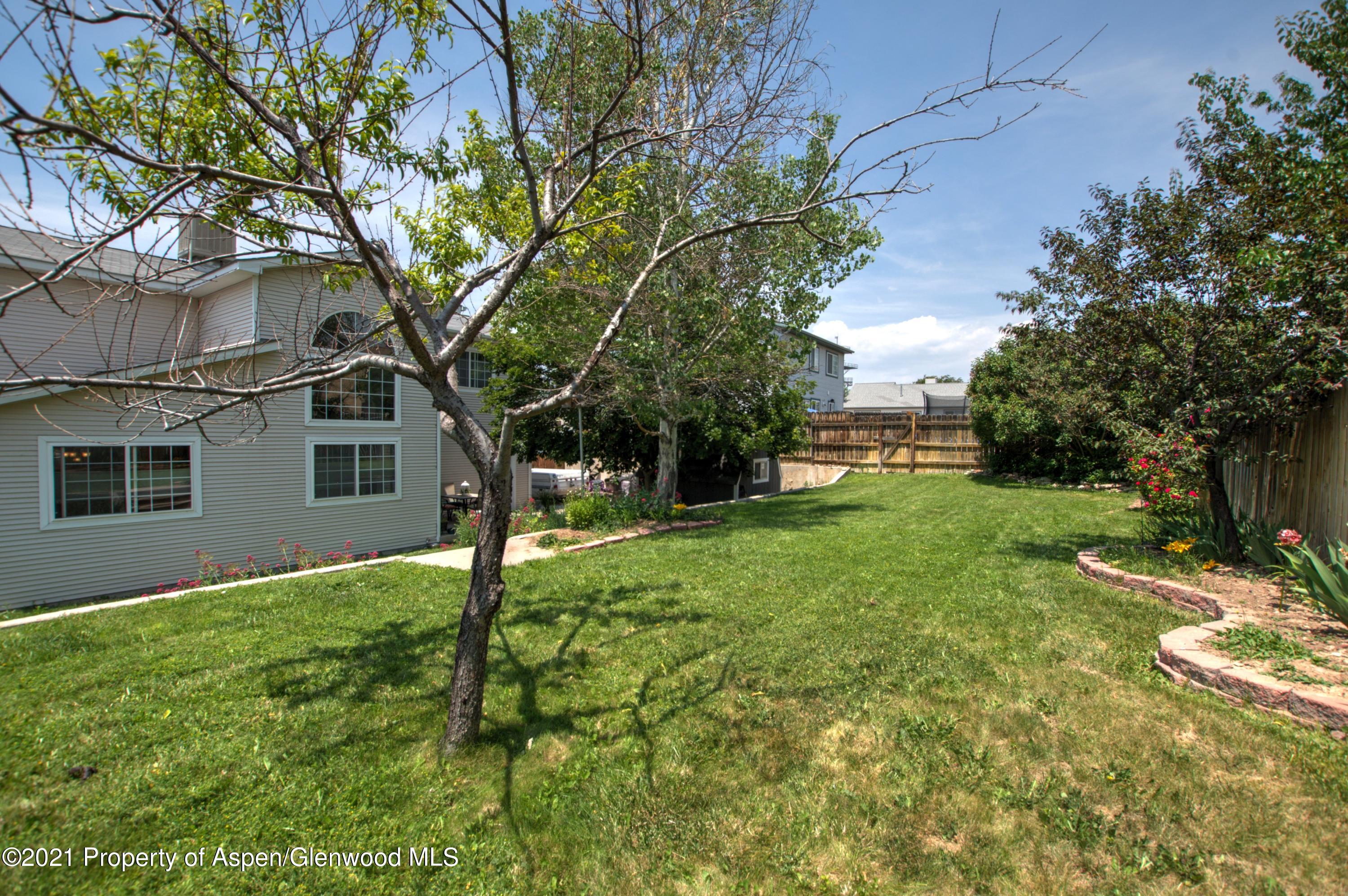 1554 East 12th Street Rifle, CO 81650 - Photo 29 of 31 a view of a house with yard and a tree