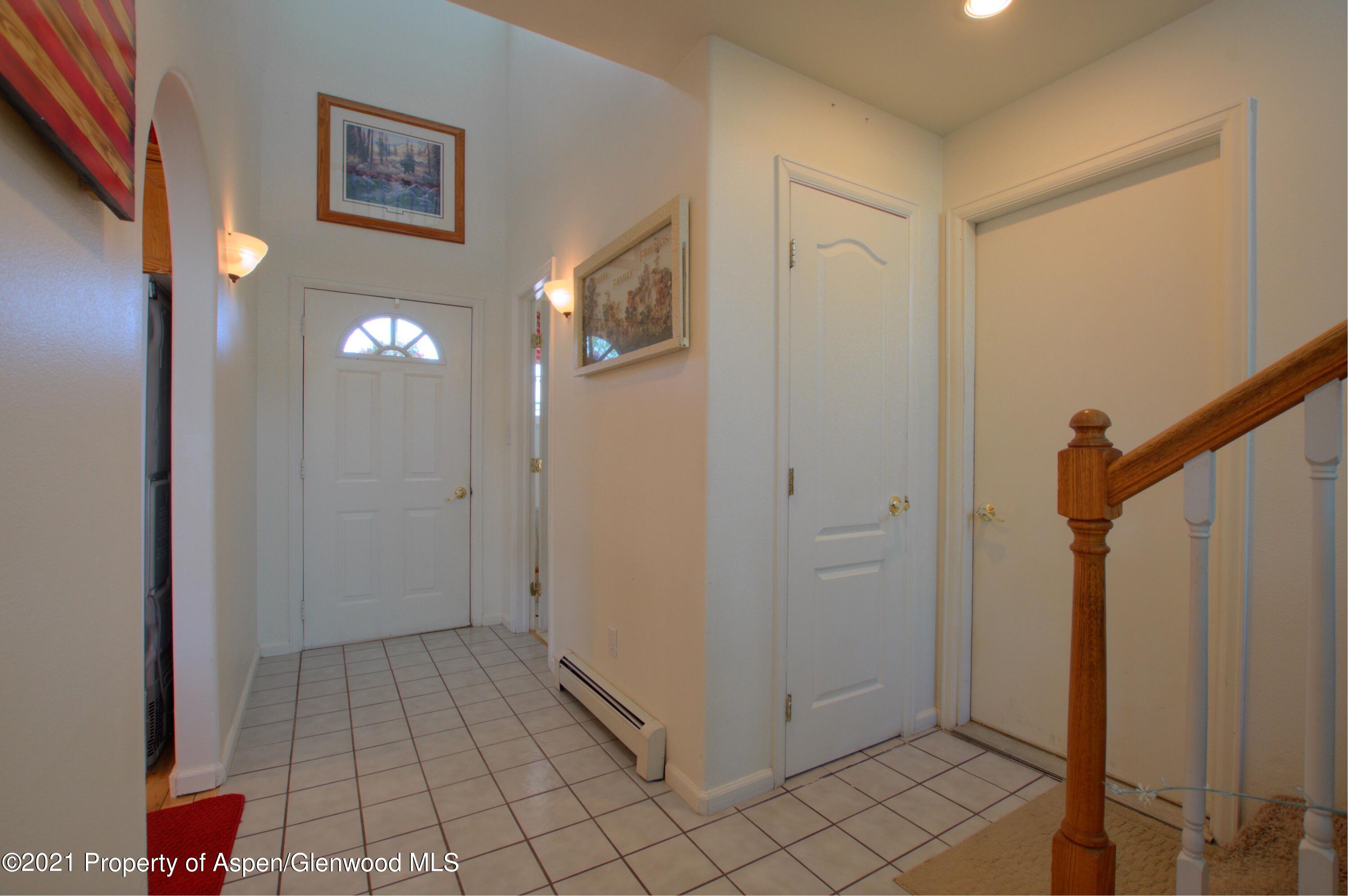 1554 East 12th Street Rifle, CO 81650 - Photo 5 of 31 a view of a hallway with wooden floor