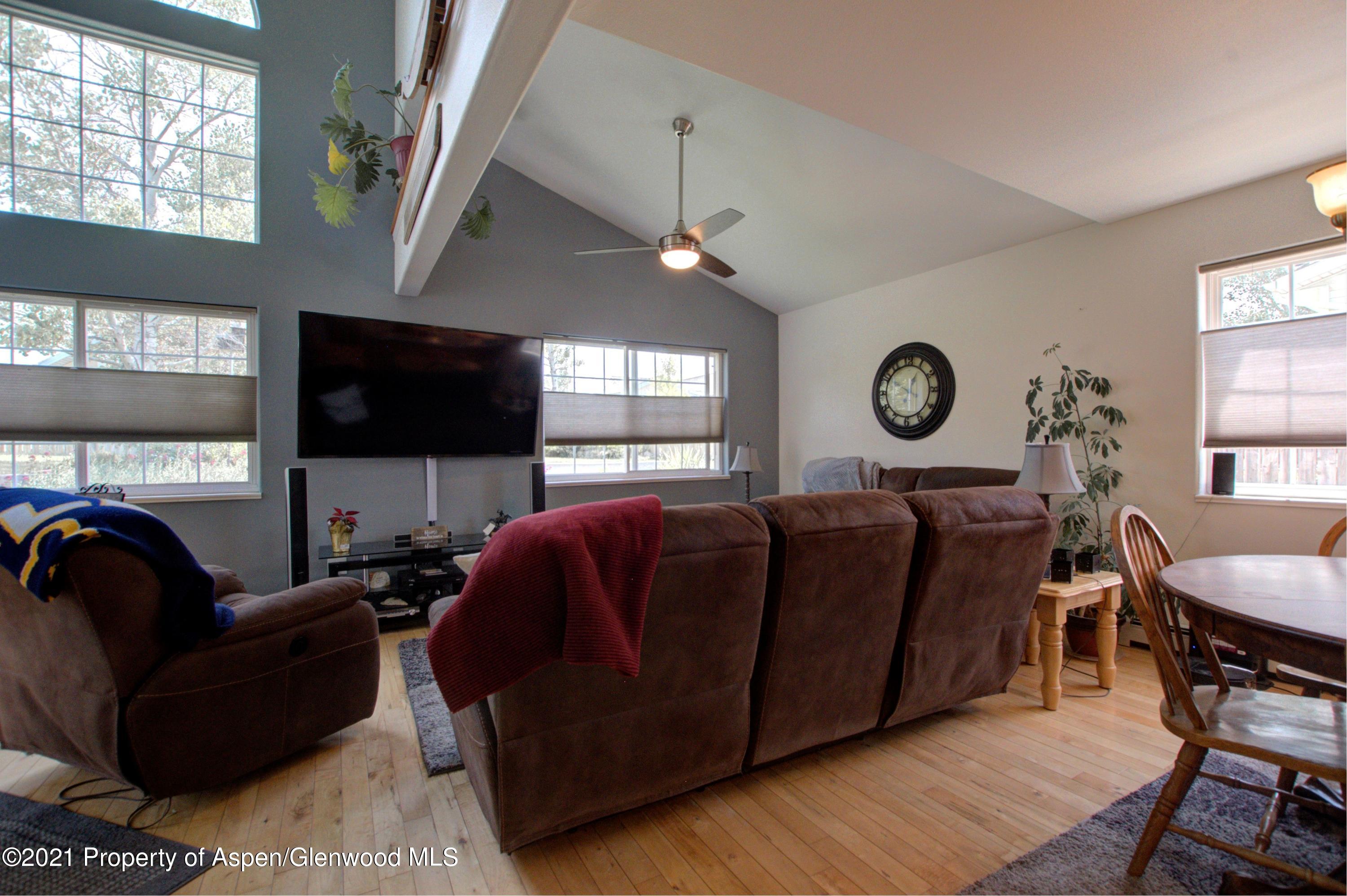 1554 East 12th Street Rifle, CO 81650 - Photo 7 of 31 a living room with furniture and a flat screen tv