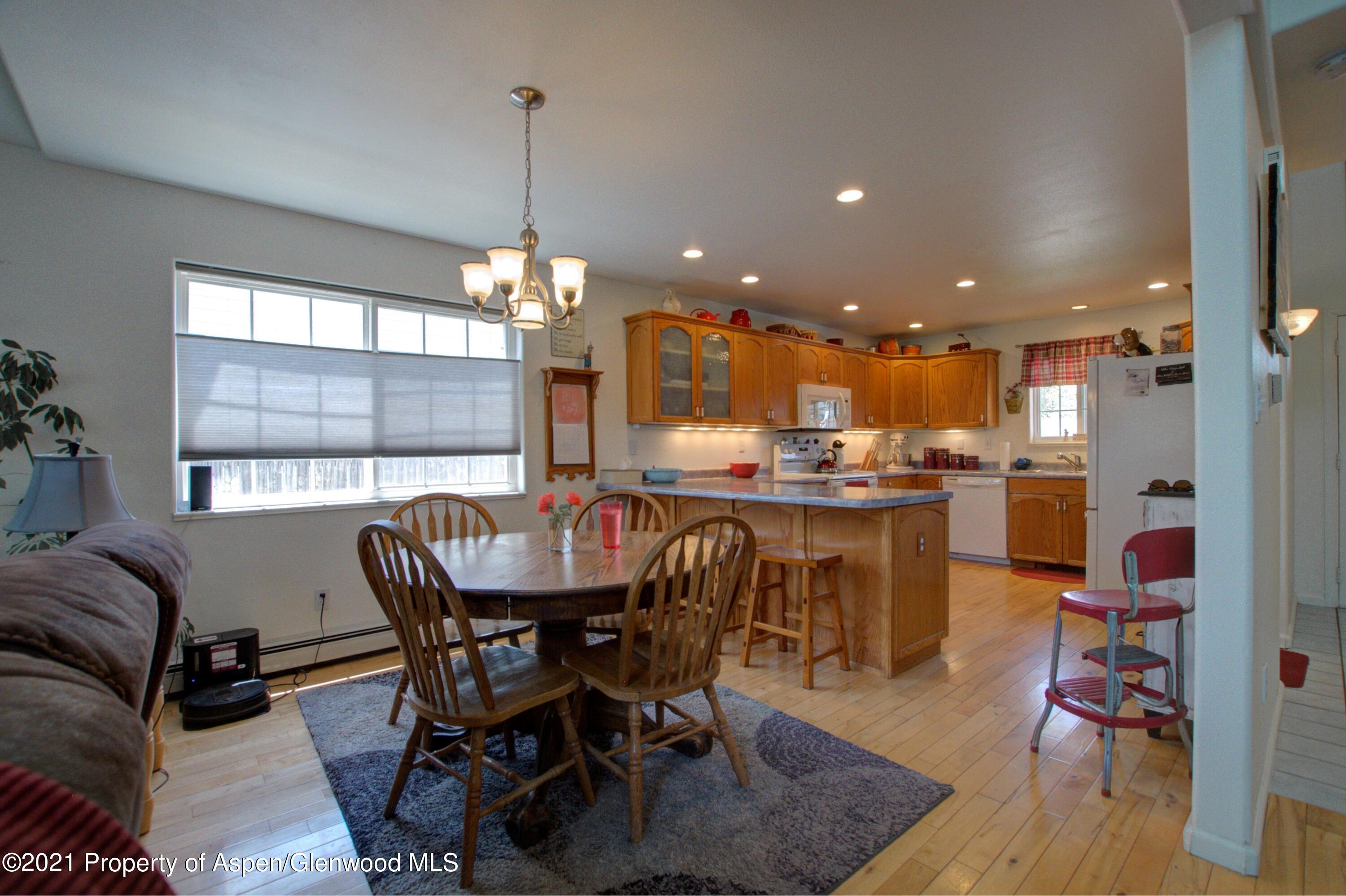1554 East 12th Street Rifle, CO 81650 - Photo 10 of 31 a dining room with furniture and window