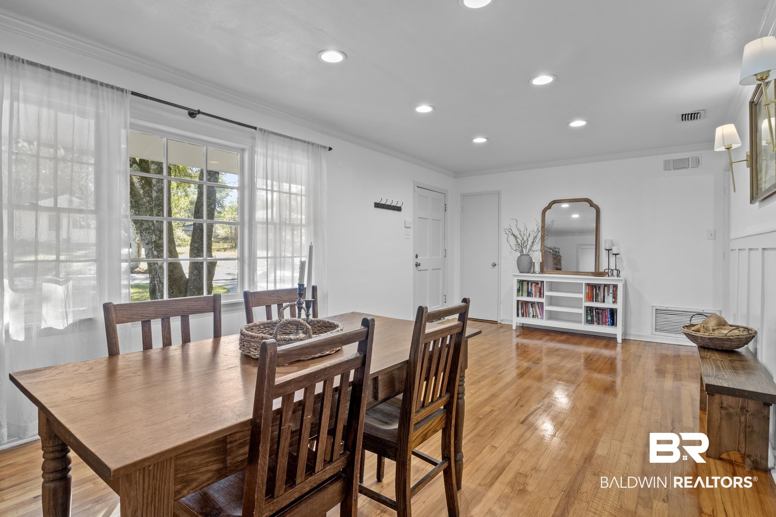 5412 Lusann Drive Mobile, AL 36608 - Photo 11 of 25 Dining space featuring light hardwood / wood-style floors and ornamental molding