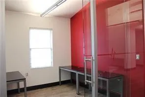 a room with a window and a chair