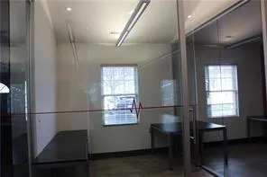 a view of entryway with window and wooden floor