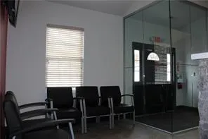 a dining room with furniture and window