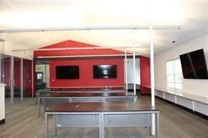 a room with pool table and flat screen tv