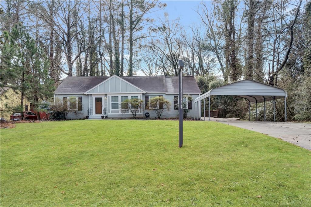 3165 Leeland Road Decatur, GA 30032 - Photo 1 of 1 a front view of a house with a garden