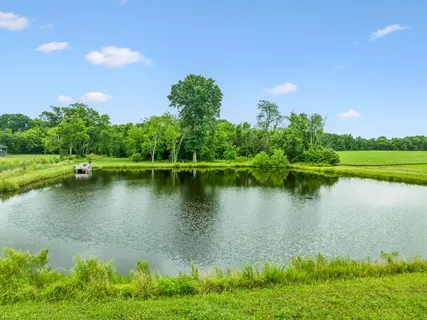 a view of a lake with a yard