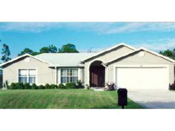 663 Southeast Raleigh Palm Bay, FL 32909 - Photo 1 of 7 a view of backyard of the house