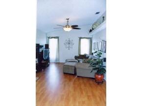 663 Southeast Raleigh Palm Bay, FL 32909 - Photo 5 of 7 a living room with furniture and a chandelier