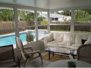 663 Southeast Raleigh Palm Bay, FL 32909 - Photo 6 of 7 a living room with furniture and a window