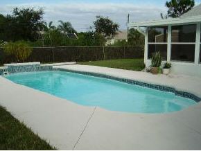 663 Southeast Raleigh Palm Bay, FL 32909 - Photo 7 of 7 a view of pool in front of house